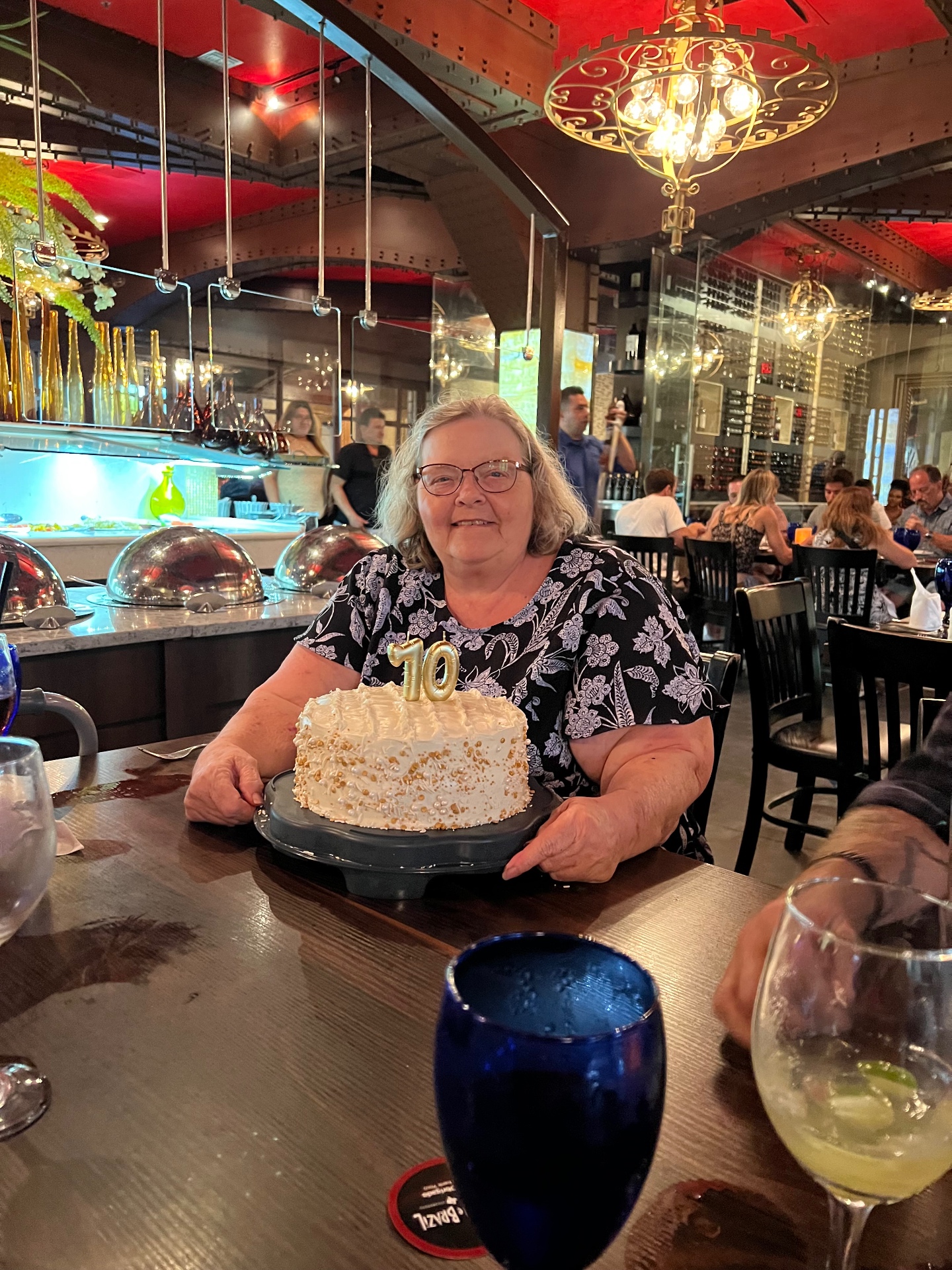 Anita's mom celebrating with a cake
